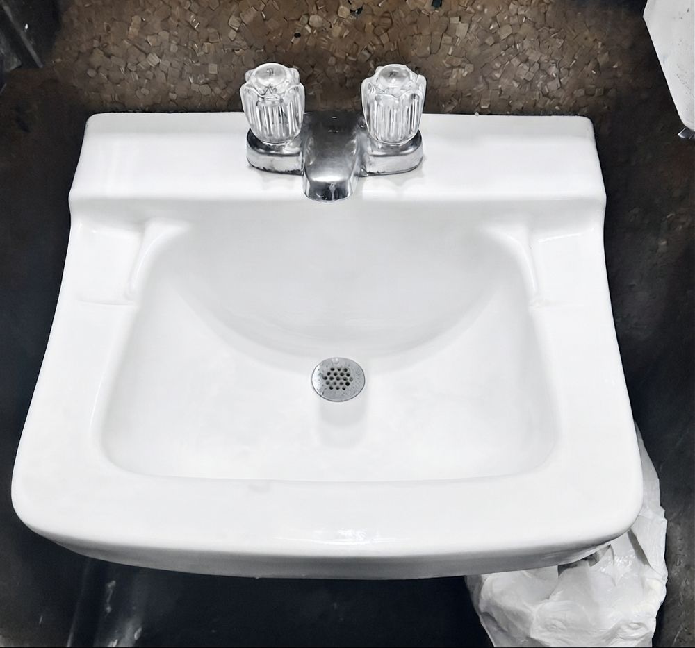 Same sink gleaming white after cleaning by Rebekah’s Cleaning Service