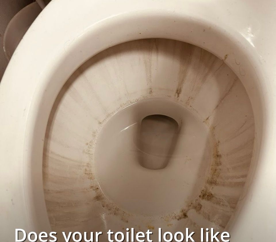 Stained toilet bowl before professional cleaning